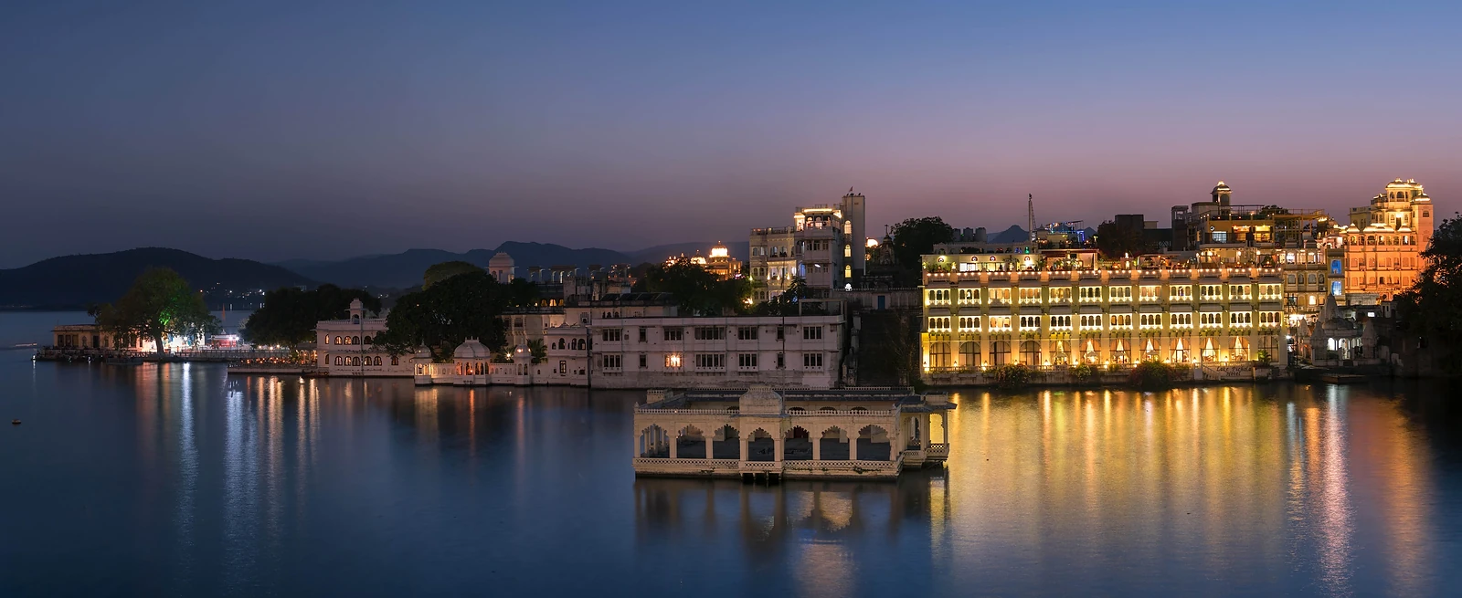 Udaipur City Palace and Lake Pichola lit up at night