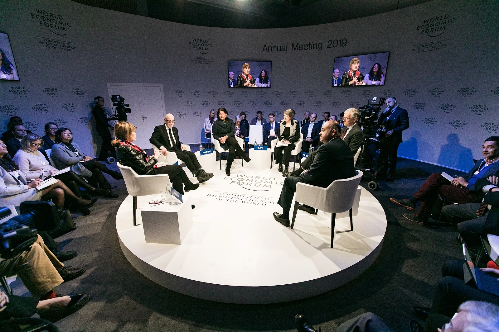 Panel discussion on stage at a conference